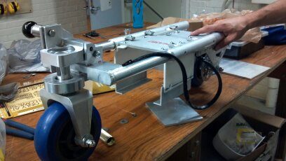 Steering column and front fork with the folding joints and caster wheels, partway through assembly