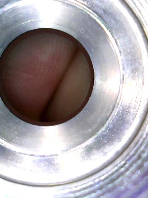 Close-up looking into the sealing seat of a rail nut