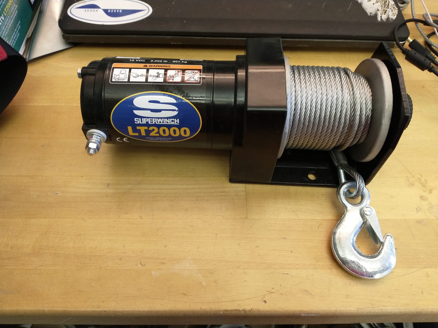 The off-the-shelf 2,000 lb ATV winch on the bench before testing