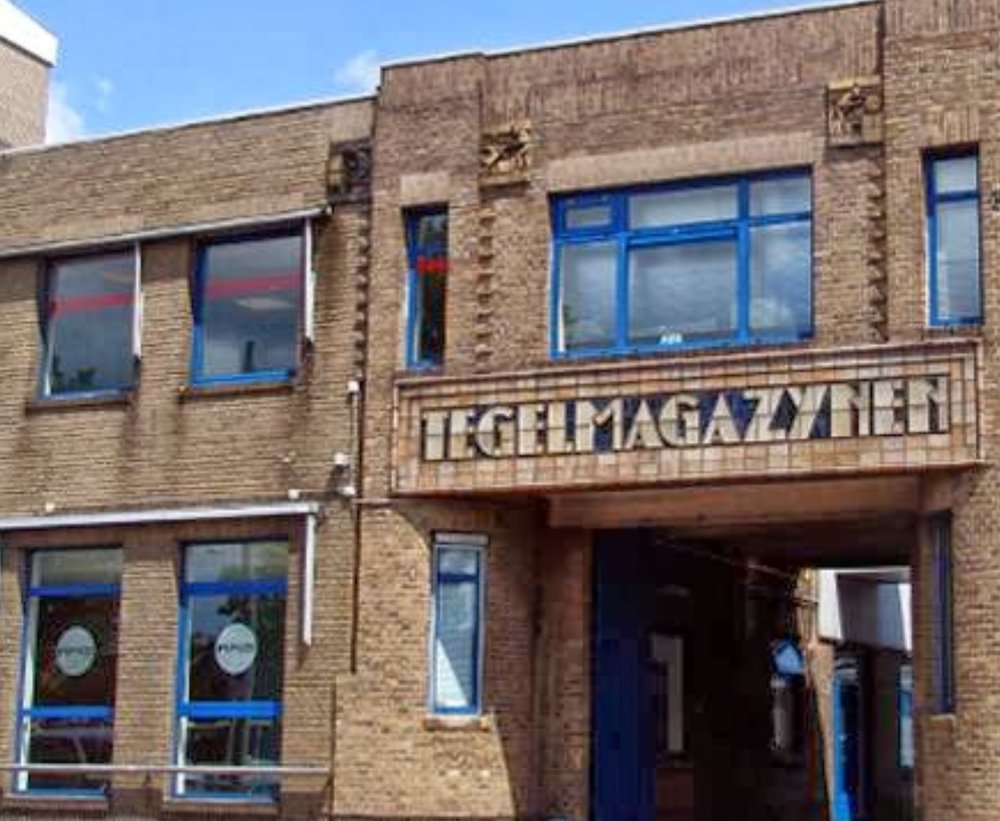 The brick front of MMID's office building in Delft, a former tile warehouse
