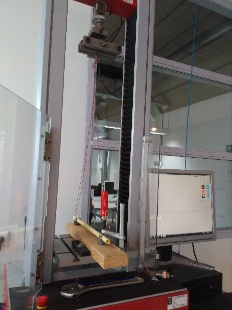 A pipe clamp specimen mounted in a tensile testing machine
