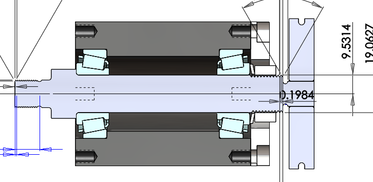 Section view of the team spindle: the steel shaft running through a housing on two tapered roller bearings, with the chuck mounting face at the right and the spindle's key dimensions called out